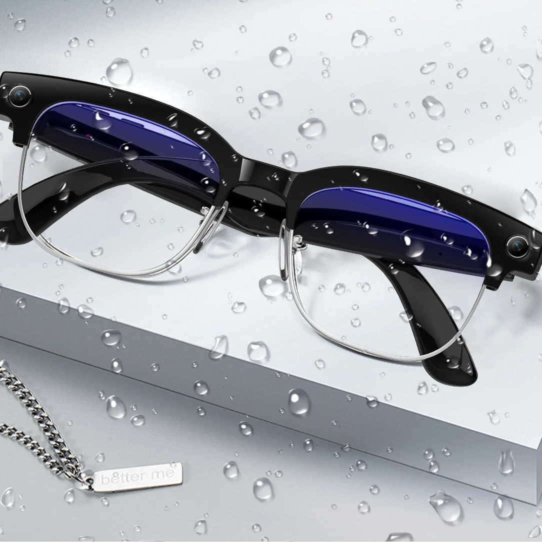 Eyeglasses with water droplets on a gray background, emphasizing dust and water resistance.