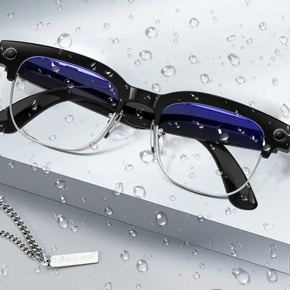 Eyeglasses with water droplets on a gray background, emphasizing dust and water resistance.